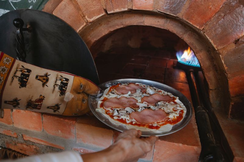 Punch pizza wood-fired oven crafting authentic pizza